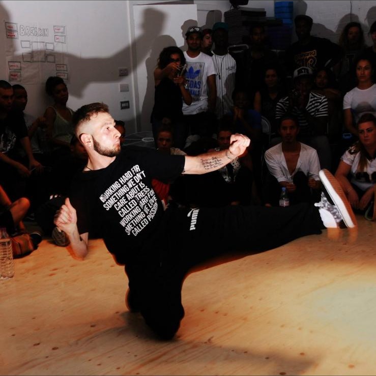 Santino Santoro breakdancing at a dance event